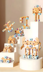 Colorful mechanical letter toys on a white surface with a beige background